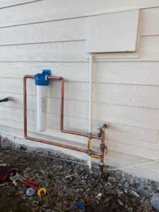 Whole-house filter housing connected to copper piping